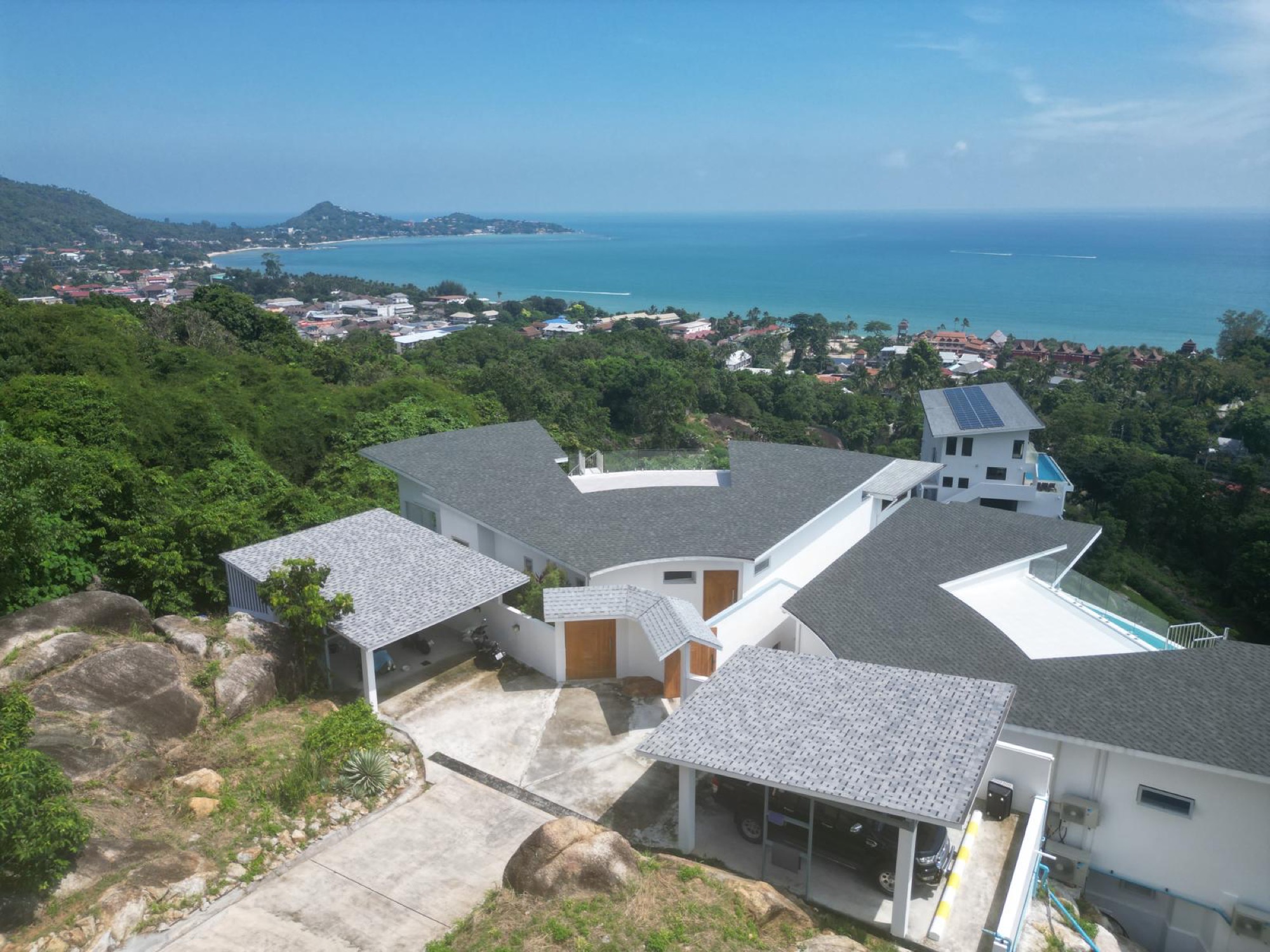 The first villa on the ridge, the sweep of Lamai bay beyond