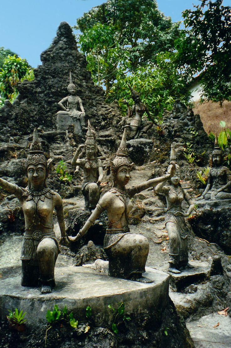 Statues among jungle greenery in the Secret Buddha Garden, Koh Samui